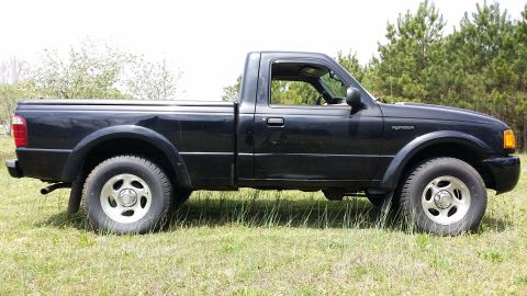 2003 Ford Ranger - Really need to do something about that dent in the door.