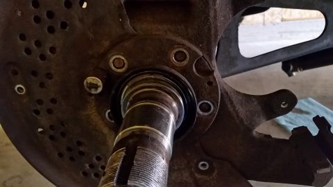 1996 Ford Bronco - To aid in spindle removal, I like to tap the bolts that hold in in place out. Less struggle removing the spindle. Lucky for me I had the sp…