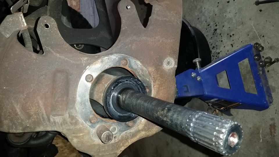 This is the view with the spindle off.  Notice the inner spindle seal--this should be replaced while you have things apart.  At this point the axle can be pulled out of the 3rd member.  Be prepared for oil to start dripping out of the 3rd member.