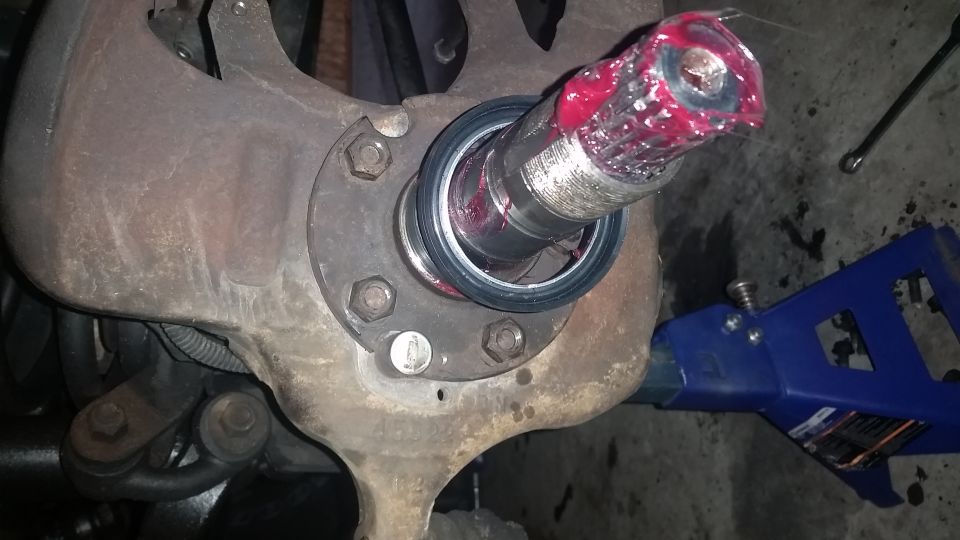 Re-assembly is everything in reverse.  Pay attention.  If you notice, in this picture I've re-attached the spindle and forgot the dust shield.  The spindle has to come back off before assembly can continue.

The nice thing about swapping 3rd members, and this is true for some Ford rear differentials as well, is that the 3rd member gearset is already set up, and there is no fiddling with shims, setting pinion depth, backlash, or anything.  Its a bolt-in procedure.  Should you need to remove any of the internal components of the 3rd member like the carrier, you may need some specialized tools like a heavy-duty case spreader.