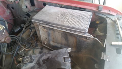 1985 Ford Bronco - Close-up of a Ford fuse box and associated wiring under the hood.