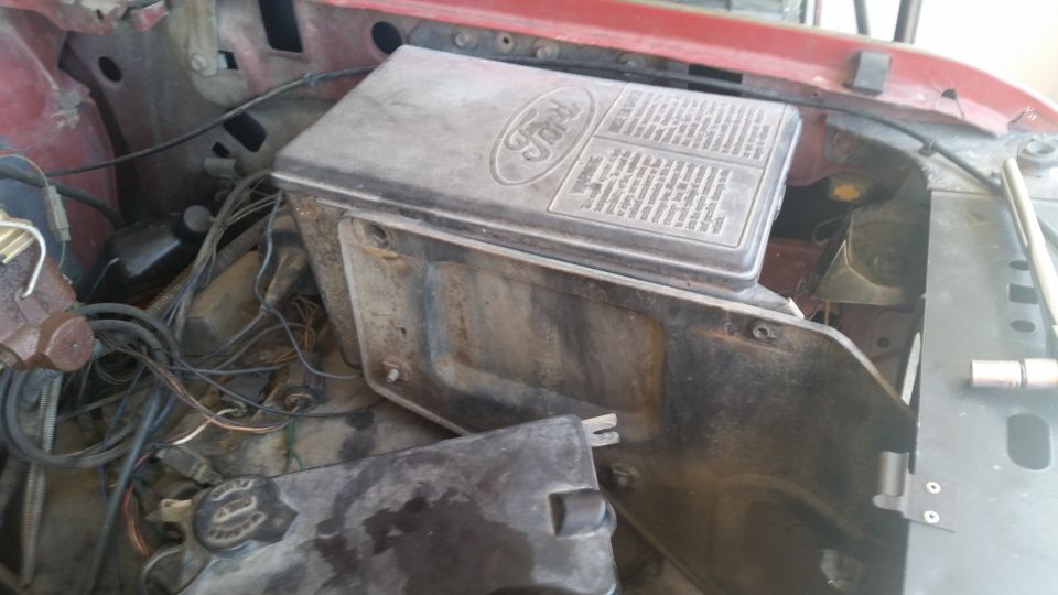 Ford fuse box with wiring and instructions visible