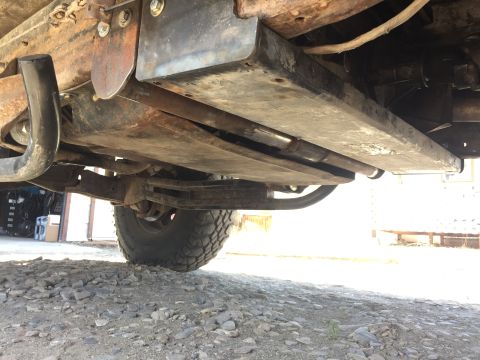 1984 Ford Bronco - Underside view of a vehicle, showing skid plates and suspension components.