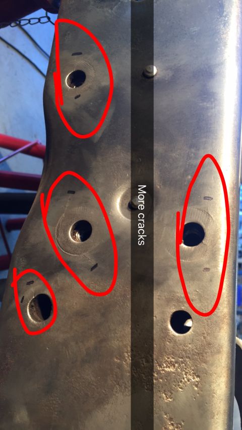 1979 Ford Bronco - Metal component showing multiple cracks, circled in red, with some black markings.