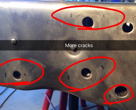 1979 Ford Bronco - Close-up view of a metal automotive part, likely a frame component, showing several cracks highlighted with red circles. The text "More cra…