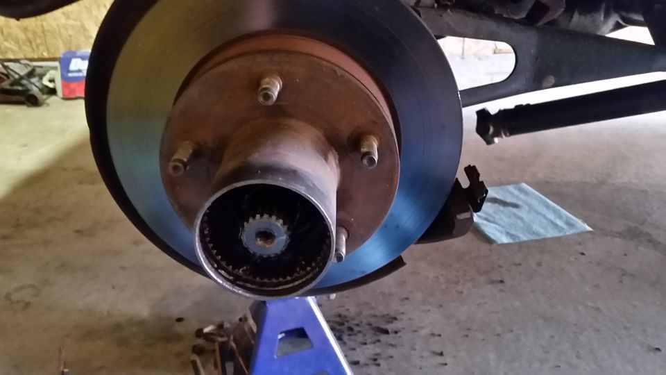 After getting the front of the truck securely on jack stands, the first thing to do is to remove the hub.