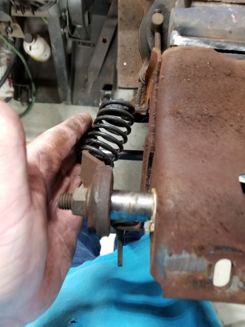 1995 Ford F-150 - The spring fork will catch inside the spring, preventing the shaft from sliding too far.