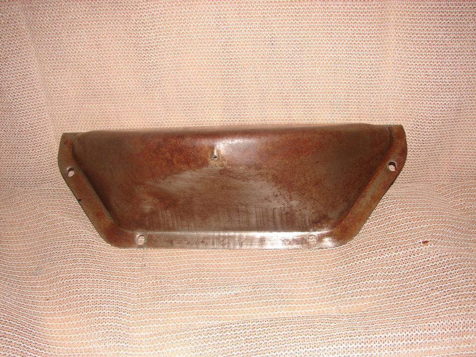 Rusty metal trapezoidal part with mounting holes