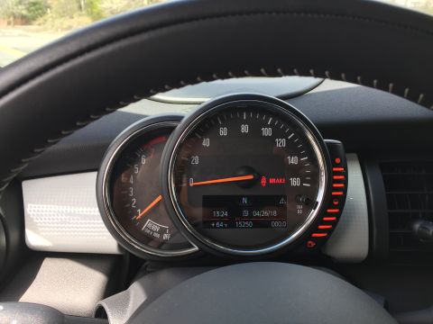 2001 Ford Crown Victoria - The image shows a close-up of a car's dashboard, focusing on the speedometer and tachometer. The digital display shows the date 04/26/18 an…