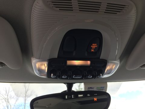 2001 Ford Crown Victoria - The interior of a car's overhead console is shown, featuring a 'PASS AIRBAG OFF' indicator light and several buttons and lights. An E-ZPass…