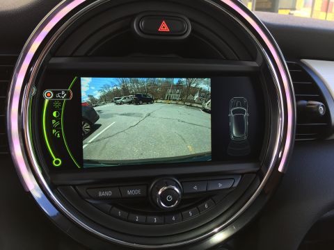2001 Ford Crown Victoria - The image shows a car's infotainment screen displaying a backup camera view and parking assist graphics. The screen is integrated into the…
