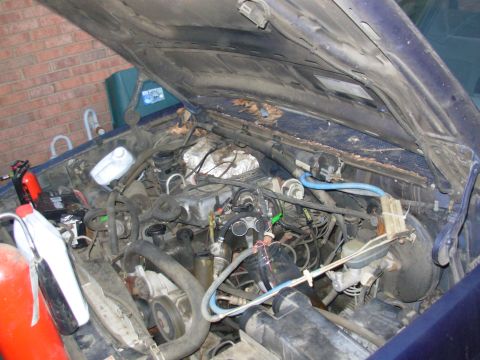 1995 Ford F-150 - Temporary fuel system includes fire extinguishers, water jugs, & a garden hose. [url=https://www.supermotors.net/registry/media/851335] htt…