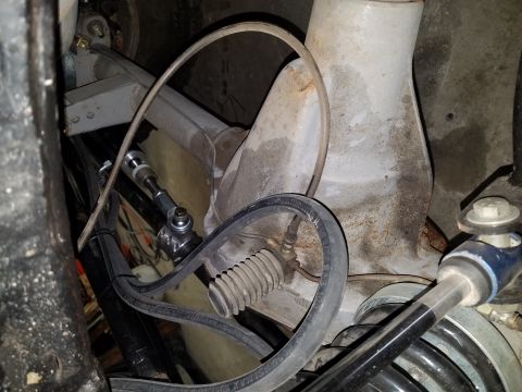 1968 Ford Bronco - This is a close-up view of the suspension and steering components of a vehicle, likely from underneath. Visible parts include a tie rod end…