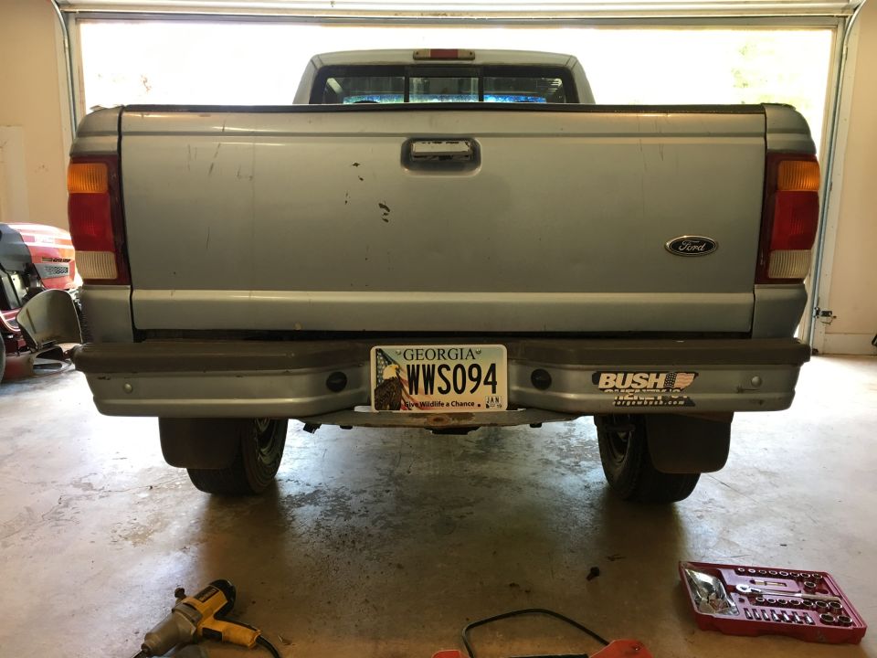 Rear view of a silver 1998 Ford Ranger pickup truck with Georgia license plate.