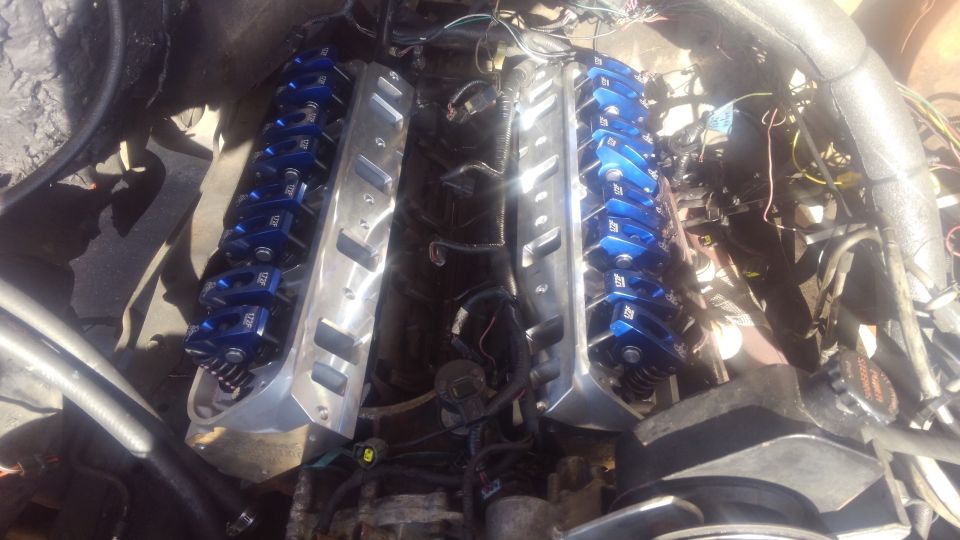 new cylinder heads on. 

unfortunately my original Explorer valve covers did not clear the rockers. a set of stock truck covers did clear with the baffles removed but i chose to order some new stamped Edelbrock valve covers