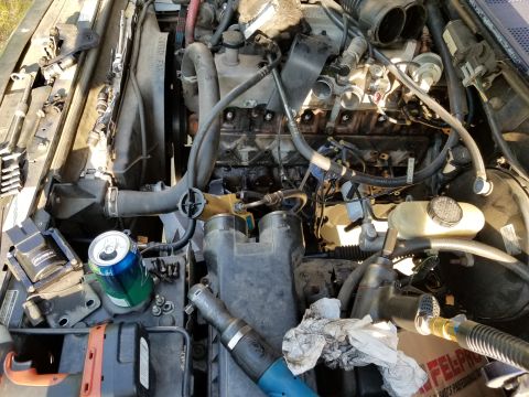 1995 Ford F-150 - I washed the engine a few days ago, and I don't want to bring oil back up inside it, so I'm working on it outside my shop. Besides: the wea…