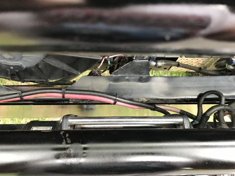 1989 Ford Bronco - A winch and associated wiring are visible beneath the vehicle's chassis.