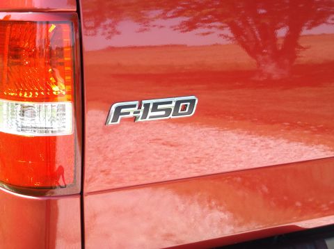 2008 Ford F-150 - Tailgate emblem on a red 2008 Ford F-150 truck.