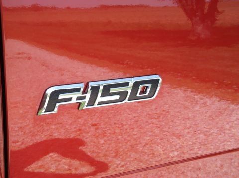 2008 Ford F-150 - The F-150 emblem is clearly visible on the red exterior of the truck.