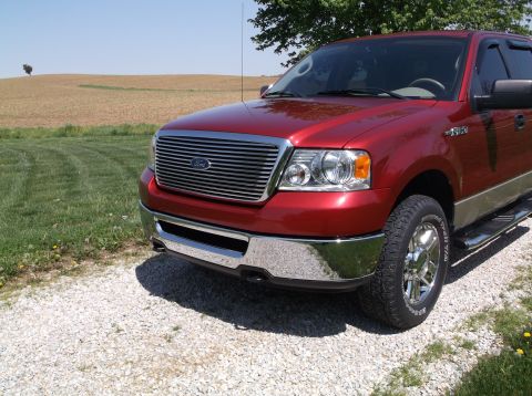 2008 Ford F-150 - Front 3/4 view of a red 2008 Ford F-150 pickup truck.