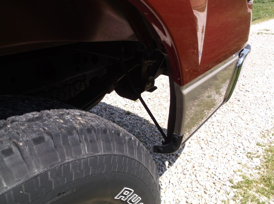 Red 2008 Ford F-150 rear wheel and two-tone lower body panel