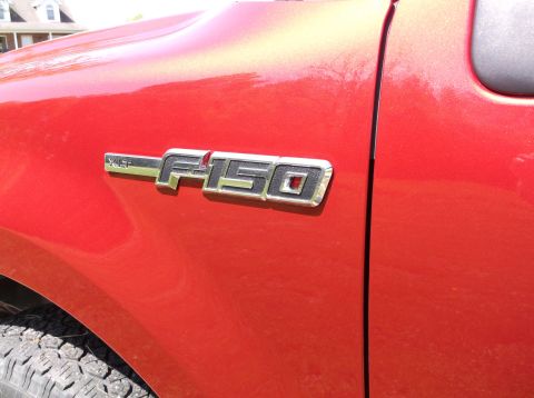 2008 Ford F-150 - Fender badge clearly reads 'F-150' on a red Ford truck.