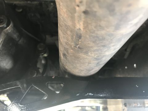 1989 Ford Bronco - Undercarriage view showing an exhaust pipe and frame components.