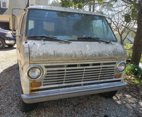 1971 Ford Ranchero - This 1971 Ford Econoline van shows significant wear and tear, parked outdoors on a gravel surface.