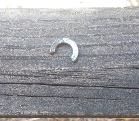 2008 Hyundai Accent - A split washer is shown resting on a wooden plank.