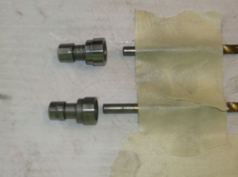 1979 Ford Ranchero - Two automotive valve components are shown with rods, secured by tape.