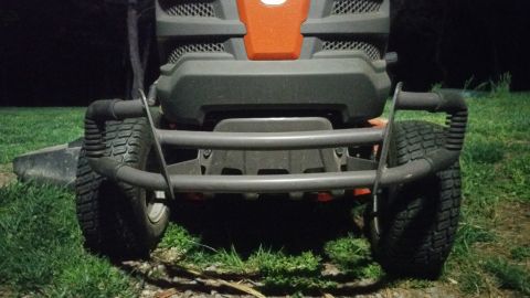 2007 Subaru Impreza - Front view of a lawn tractor a brush guard and large tires.