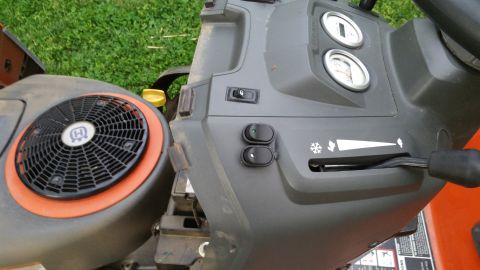 2007 Subaru Impreza - Dashboard controls of a lawn tractor, gauges, switches, and a speed lever. The Husqvarna logo is on the engine cover.