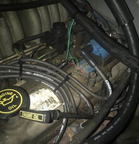 1995 Ford Bronco - Close-up view of an engine bay, showing various components and wiring.
