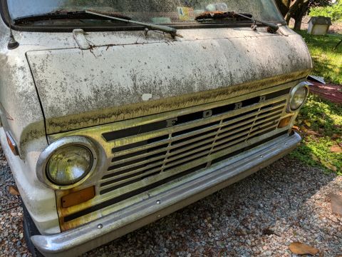 1971 Ford Ranchero - This weathered Ford van, likely from the late 1960s, shows its distinctive grille and front end.