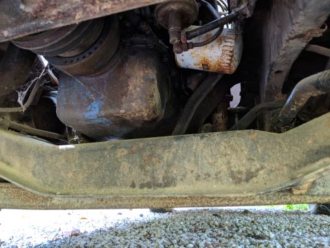 1971 Ford Ranchero - Underside view of an engine's oil pan and filter, showing signs of age and wear.