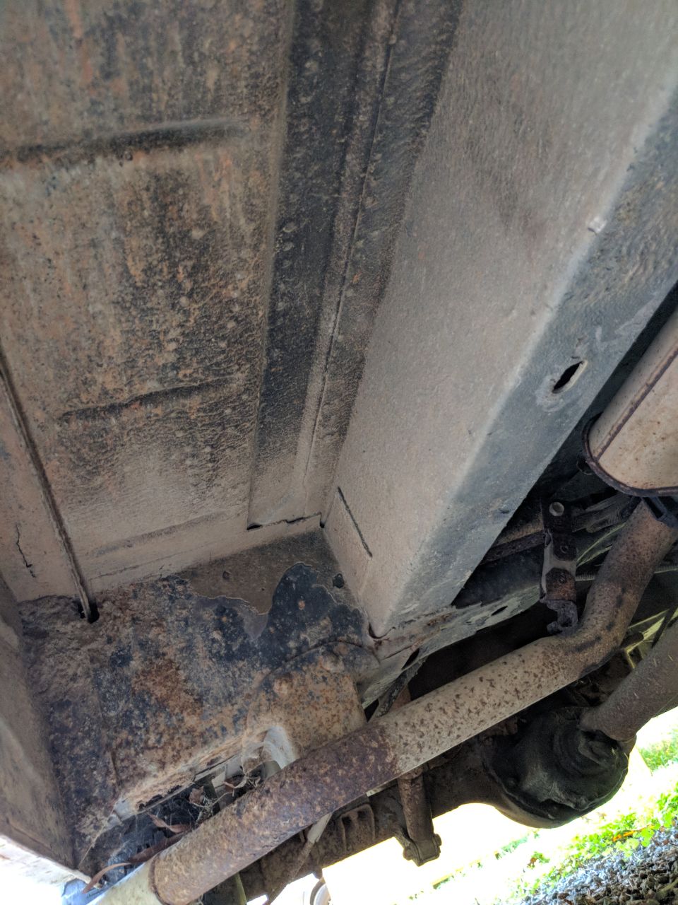 Underside view of vehicle frame and exhaust system
