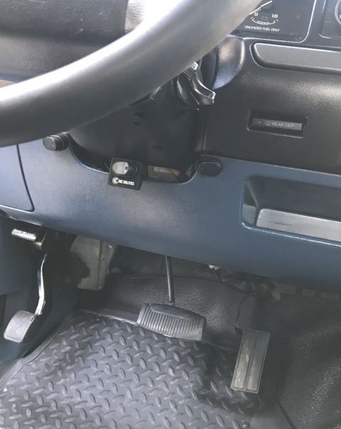1995 Ford Bronco - Interior view of a 1995 Ford Bronco, highlighting the pedals and an aftermarket switch.