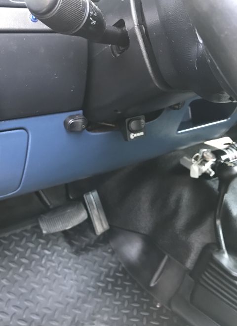 1995 Ford Bronco - Interior view of a vehicle's dashboard, showing pedals and switches.