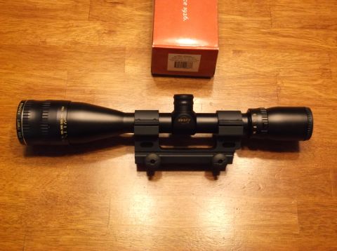 1995 Mercury Grand Marquis - A rifle scope with a Swift logo is shown next to its box, which indicates it has been in production since 1926.