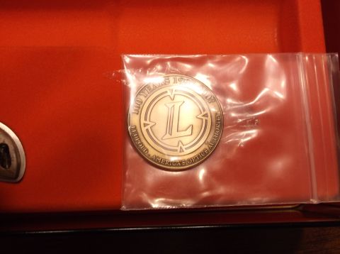 1995 Mercury Grand Marquis - A coin commemorating 100 years of Leupold America's Optics Authority is shown.