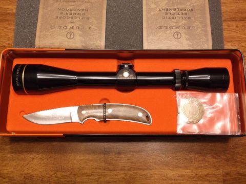 1995 Mercury Grand Marquis - A Leupold rifle scope, knife, and coin are displayed in a fitted orange box with accompanying paperwork.