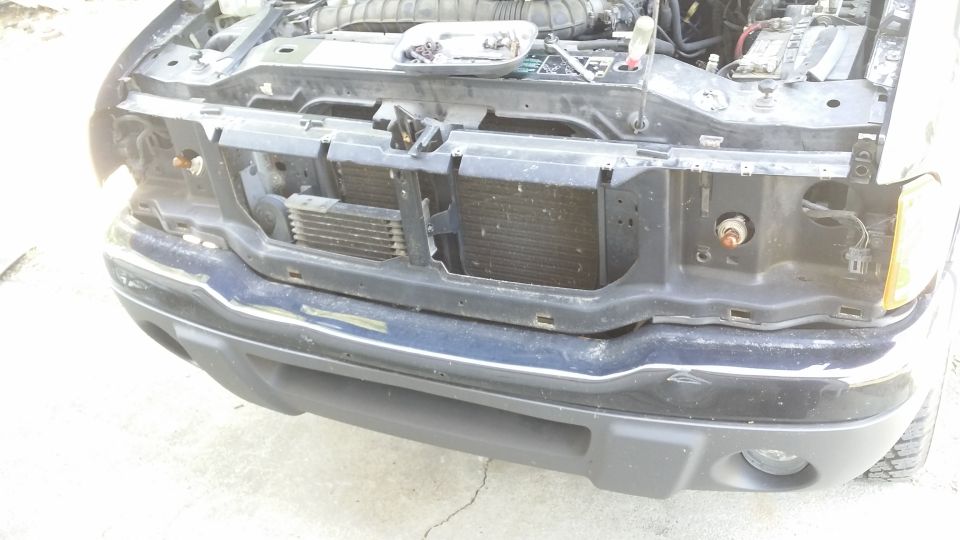 What happened to my truck?!
10 bolts across the top and 6 clips on the bottom and the front end comes off. Probably not completely necessary for the headlights to come off but being as this was the first time I have pulled this generation Ranger apart I was not taking any chances.