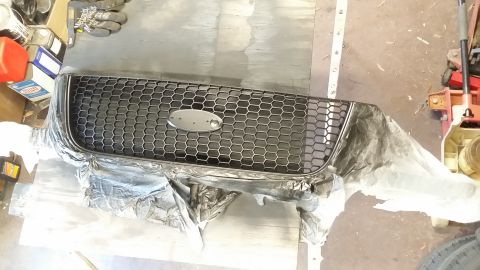2003 Ford Ranger - Hmmm. Sidenote: The honeycomb grille CAN be separated from the whole unit but I chose to just mask instead of risking breaking anything.