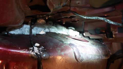 2000 Pontiac Grand Prix - This photo shows a section of a vehicle's underbody that has been repaired with expanding foam and has wiring present.