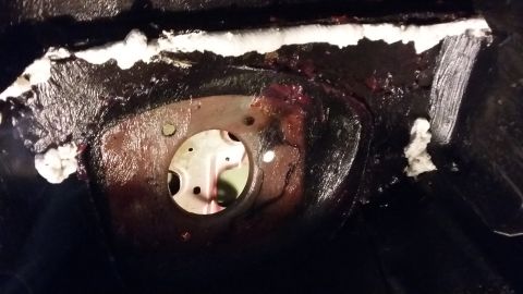 2000 Pontiac Grand Prix - Undercarriage view of a vehicle component, possibly related to suspension or drivetrain, showing signs of wear and repair.