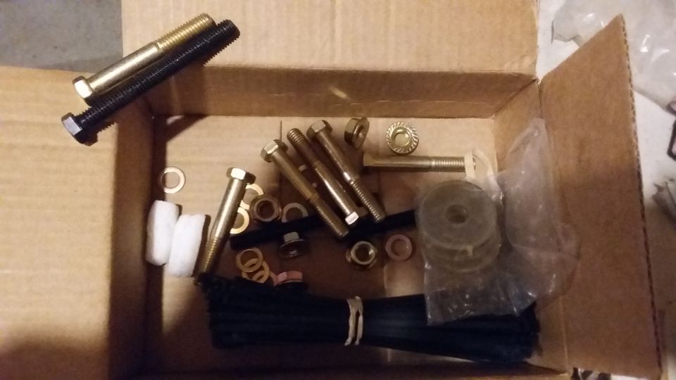 Box of assorted bolts, nuts, washers, and zip ties