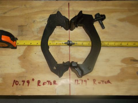 1979 Ford Ranchero - Two brake caliper brackets are shown with measurements indicating different rotor sizes.
