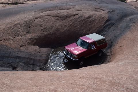 1995 Ford Bronco - This 1995 Ford Bronco tackles a water obstacle on a off-road trail.