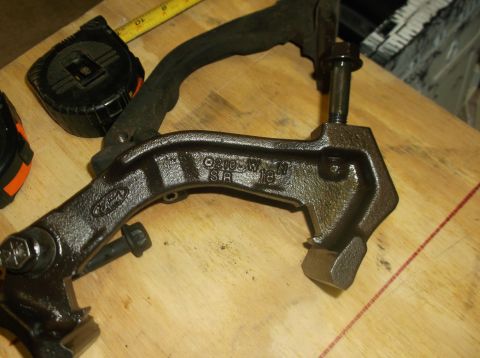 1979 Ford Ranchero - Close-up of a Ford brake caliper bracket, possibly from a 1979 model, showing part number 02105W.