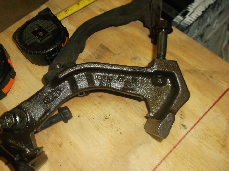 Ford brake caliper bracket with part number 02105W